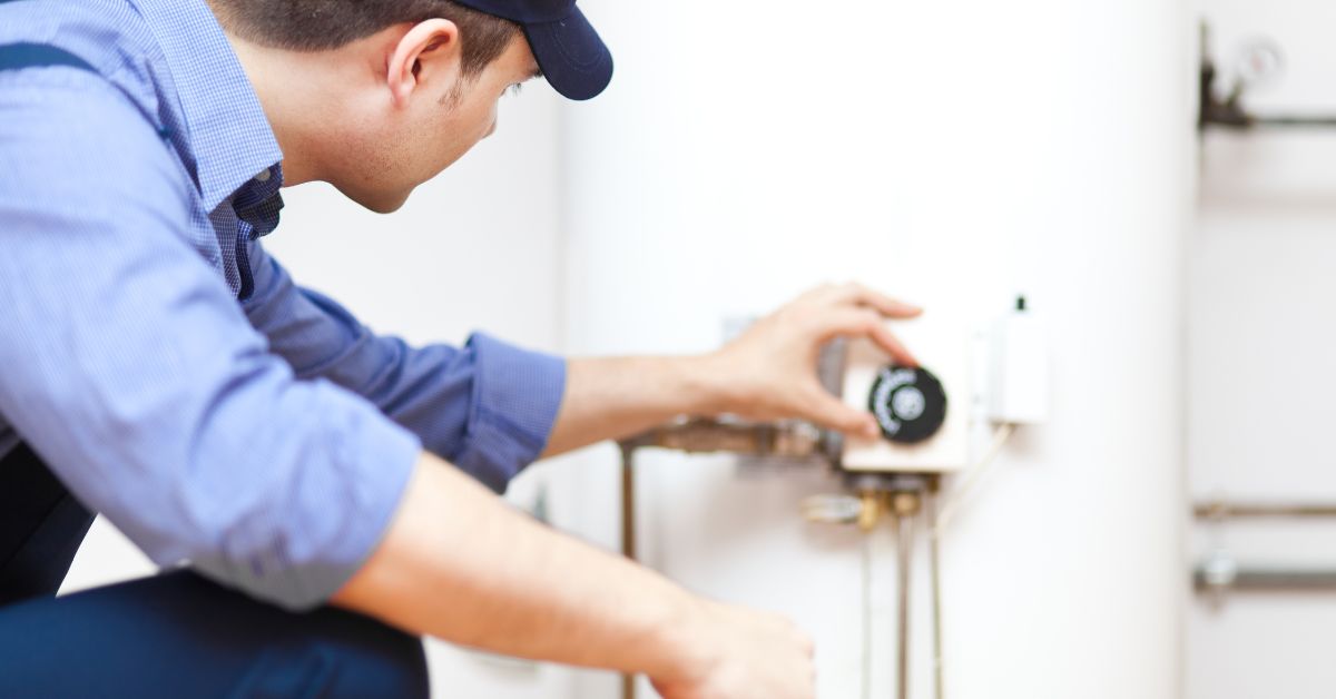 man working on water heater